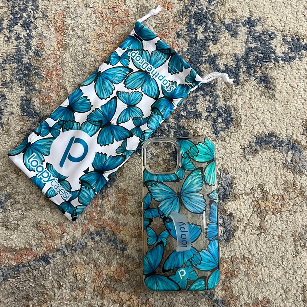 Loopy Clear Butterflies. Excellent Condition. iPhone 13 (6.1”). Comes with bag.